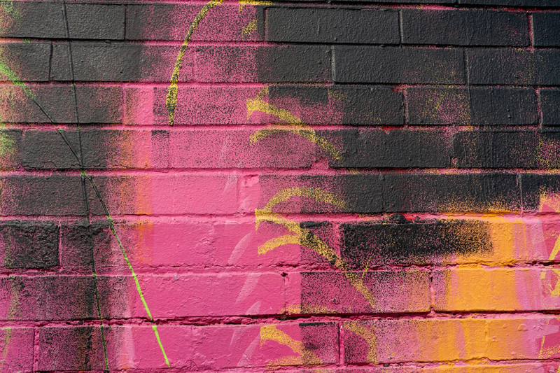 Vibrant Graffiti Brick Wall